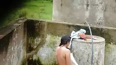 Indian Village Girl Bathing Near Water Tank Outdoor