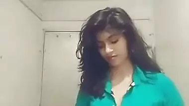 Indian teen unbuttons green shirt and takes it off just like her bra