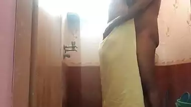 Amateur Indian sex video where man fucks wife from behind in bathroom