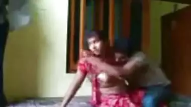 Indian couple enjoying in a hotel room