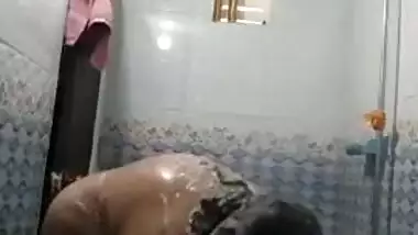 Fatty Desi woman's roomie sets hidden camera to film shower porn video