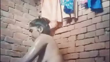 Attractive Desi village girl displays XXX assets while bathing nude