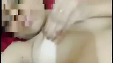 Desi girl exposes XXX boobies and pinches brown nipples holding camera