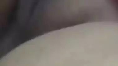 Relaxed Desi aunty lies on the bed with her sweet XXX vagina exposed