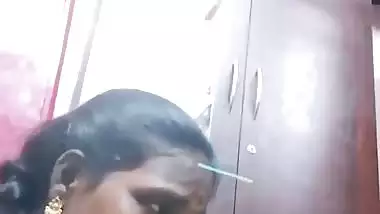 Mature tattooed Tamil wife giving handjob to husband