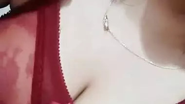 Sexy cute girl shows her big round boobs