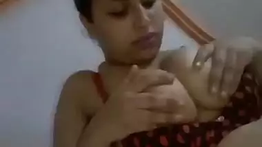 Beautiful girl playing with her big round boobs