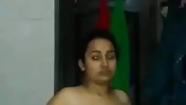 Sexy desi girl showing her boobs and fingering pussy