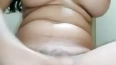 Busty girl fingering her hairy pussy hard on cam