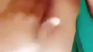 Horny girl squeezes her boobs and fingers her hairy pussy