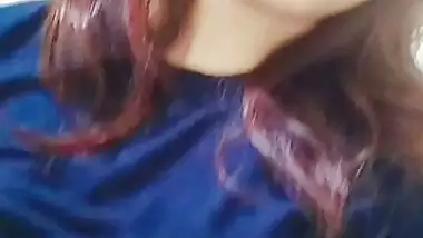 Beautiful girl lifting dress and showing big boobs
