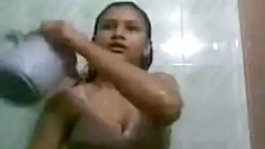 Indian teen takes a shower and gets dressed.