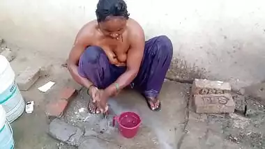 Desi village Bhabhi bathing topless on cam