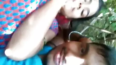 Loving Indian couple kisses lying on grass before porn action