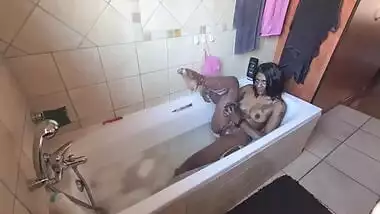 A desi Indian slut giving her dark petite body a sexy steamy bubble bath.